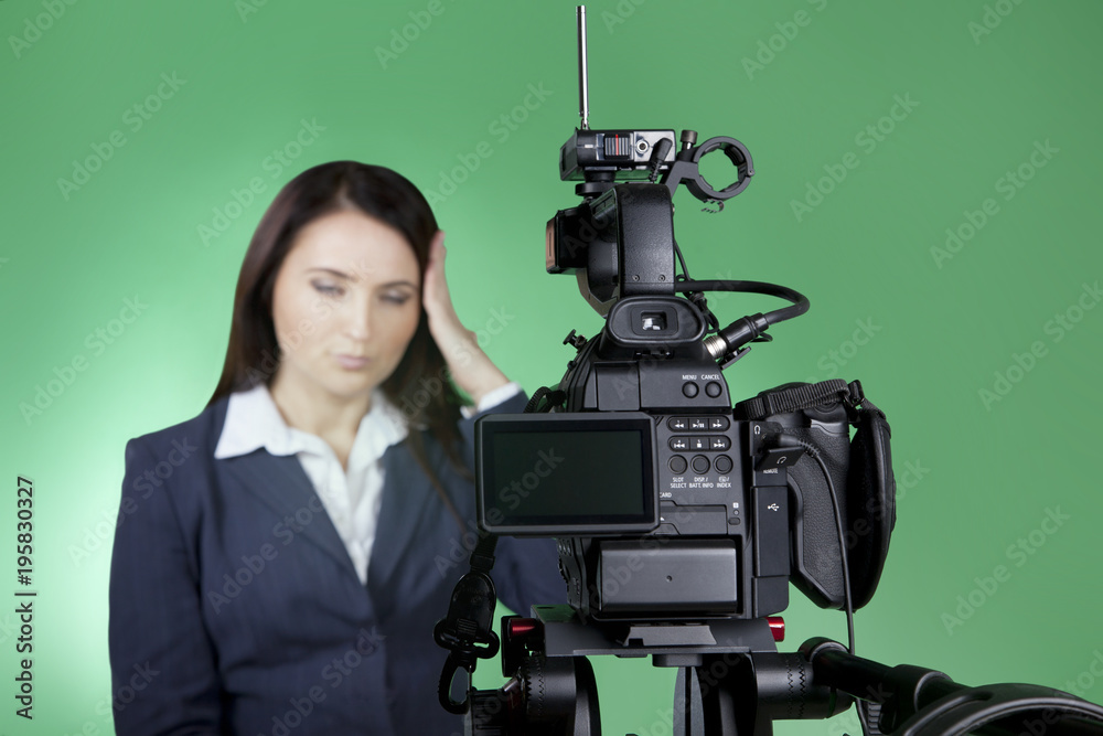 Blur image. Television announcer at studio isolated on a green
