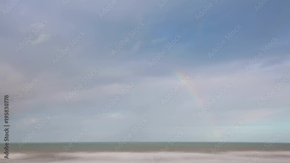 Rainbow and dramatic sky of Atlantic ocean timelapse Rainbow and dramatic sky of Atlantic ocean timelapse