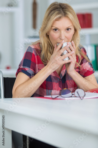 woman in wheelchair hot drink at home