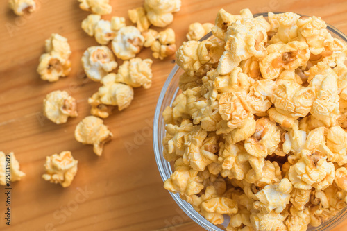 Selective focus Popcorn on wooden table.
