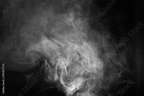 White smoke texture on a black background. Texture and abstract art