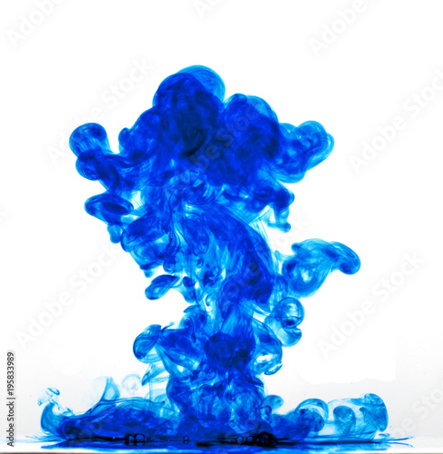 Blue ink in water against a white background.