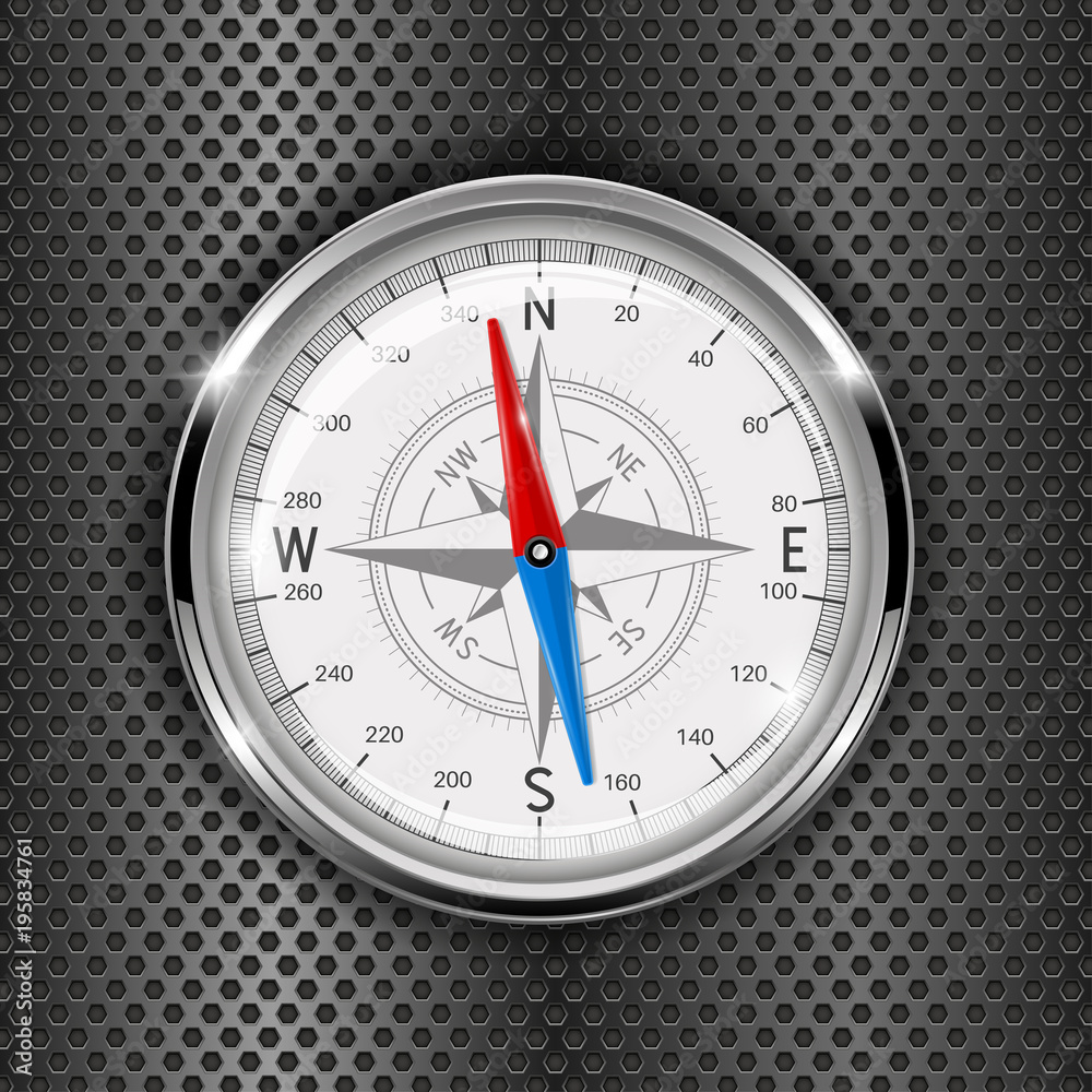 Compass. Metal gauge on iron perforated background Compass. Metal gauge on iron perforated background