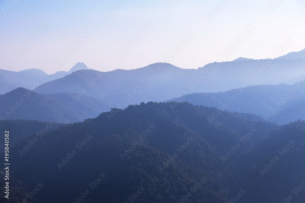 sunrise white fog  in early morning on high angle view of layer tropical mountains with at Thailand.