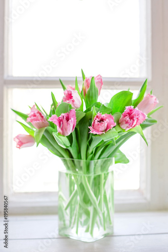 Pink tulips in a glass vase © tamila240885