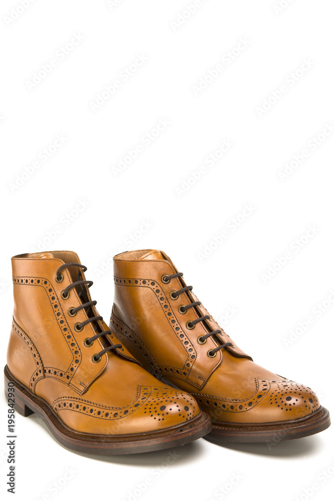 Footwear Ideas. Premium Tanned Brogue Derby Boots Made of Calf Leather with Rubber Sole. Isolated Over Pure White Background.