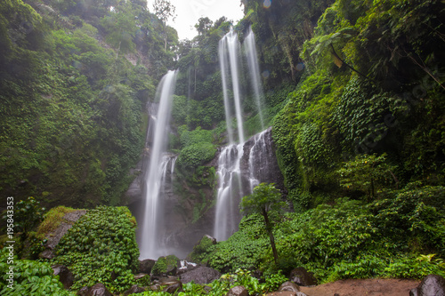 Hidden in jungles beautiful Sekumpul waterfall on Bali  Indonesia