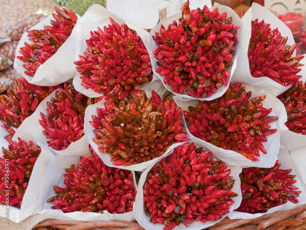 bunches of red chili pepper to have taste and beauty in the kitchen bunches of red chili pepper to have taste and beauty in the kitchen