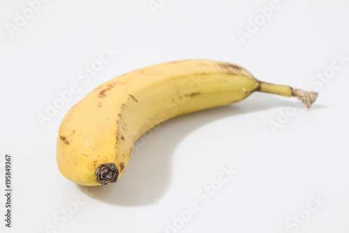 Yellow banana in a white background composition photo