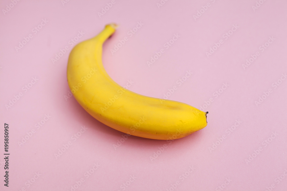 ripe banana on a pink background