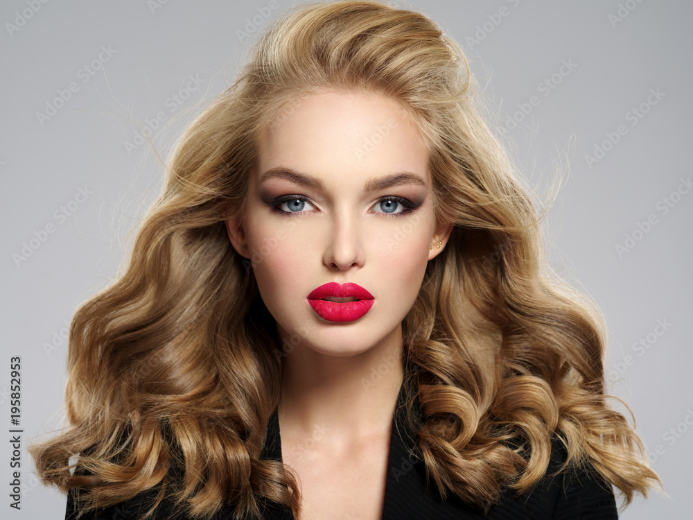 Fototapeta premium beautiful young blond girl with sexy red lips.