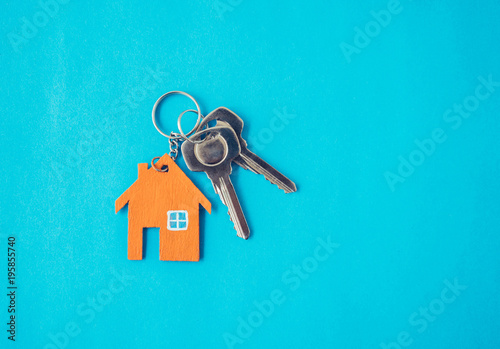 House and key on blue background. © natara
