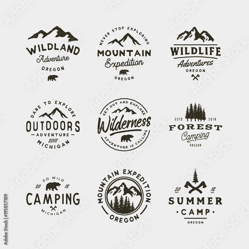 set of vintage wilderness logos. hand drawn retro styled outdoor adventure emblems. vector illustration photo