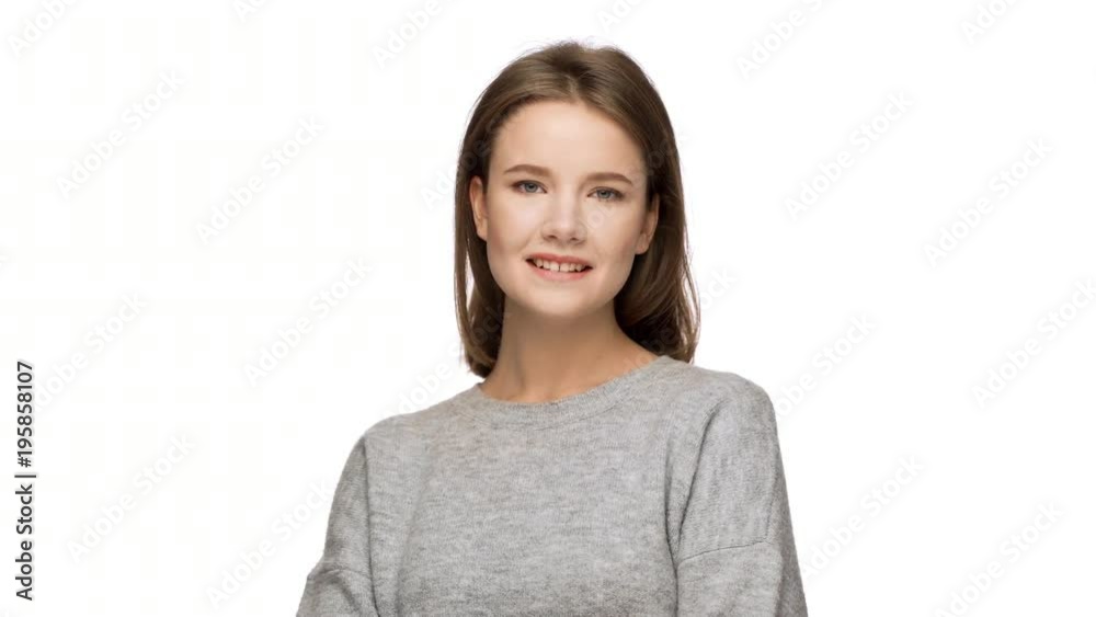Portrait of beautiful woman with auburn straight hair winking and posing at camera with flirty look, isolated over white background in studio. Concept of emotions Portrait of beautiful woman with auburn straight hair winking and posing at camera with flirty look, isolated over white background in studio. Concept of emotions