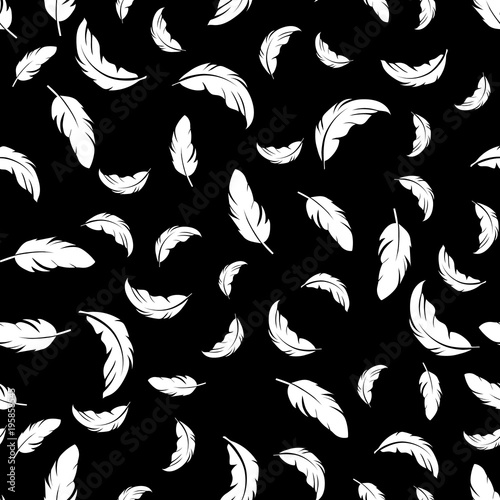 Feather seamless pattern on black background. Vintage card for fabric design.Peacock feather seamless pattern.
