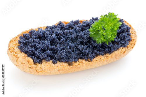 Canapes with black sturgeon caviar and parsley. Isolated on the white background.