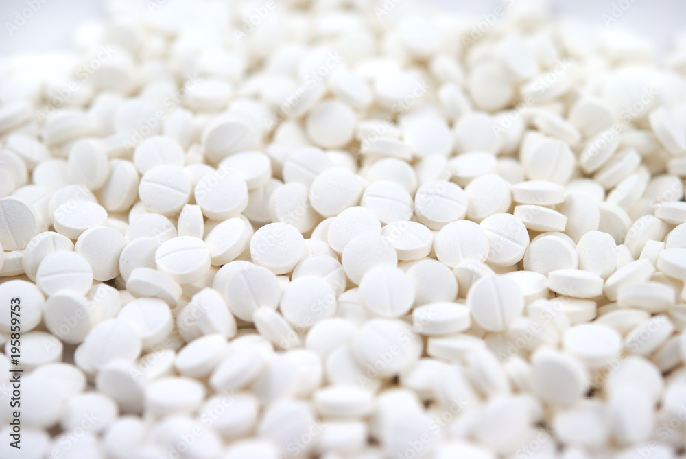White round tablets close-up background White round tablets close-up background