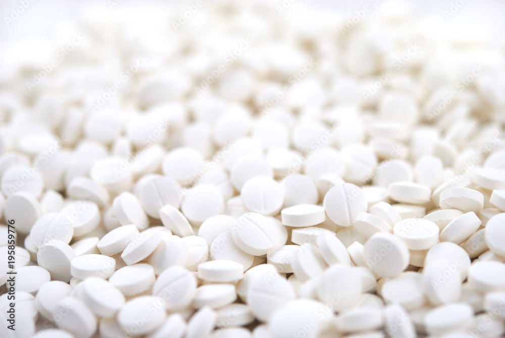 White round tablets close-up background