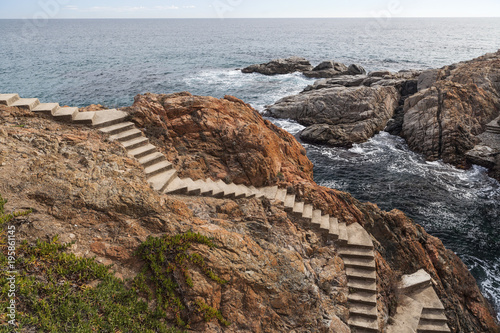 Parapet walk, cami de ronda, by the mediterranean sea in Costa Brava, S Agaro, Catalonia, Spain. photo