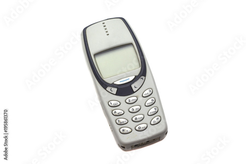 Old gray mobile phone isolated on white background 