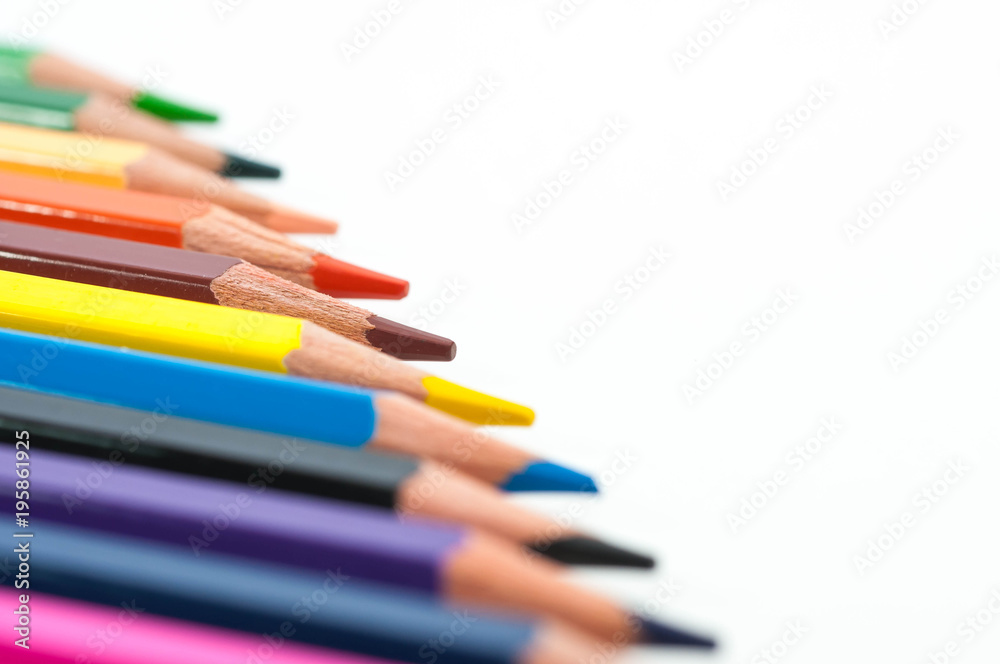 Group of color pencils close up macro shot isolated on white background. Group of color pencils close up macro shot isolated on white background.