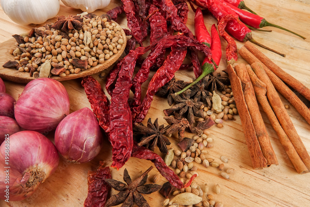 Mixture of beautiful spices and herbs on a wooden table Mixture of beautiful spices and herbs on a wooden table