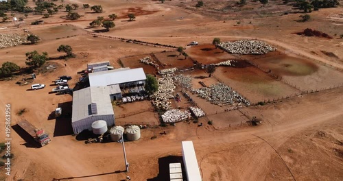 Drone flying around large sheep shearing operation in Outback NSW, Australia. 