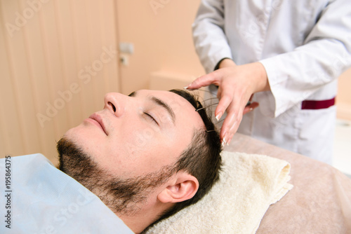 Head massage in beauty clinic
