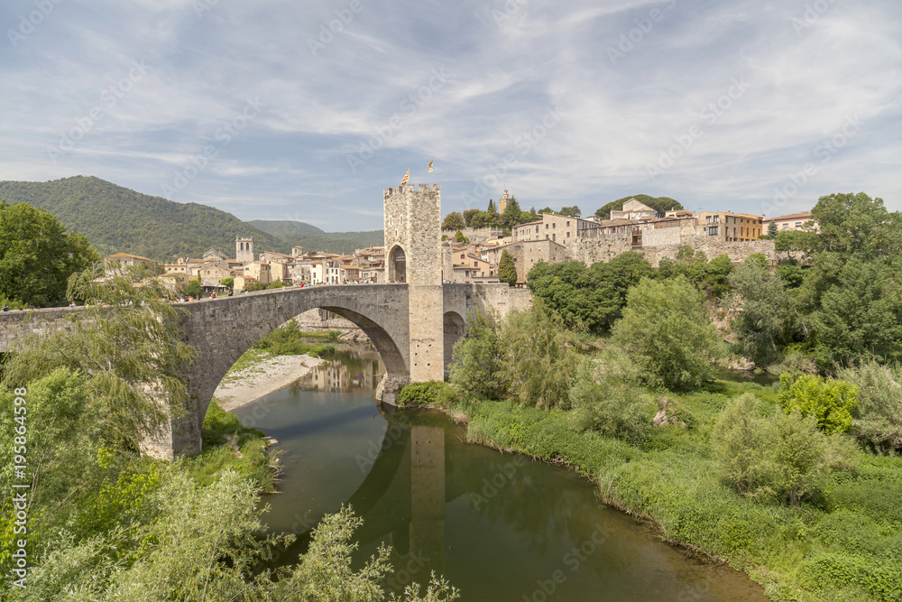 Besalu,Catalonia,Spain. Medieval bridge, romanesque style. Village view.