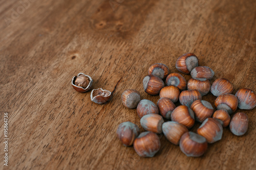 hazelnuts on a wooden background © Svitlana