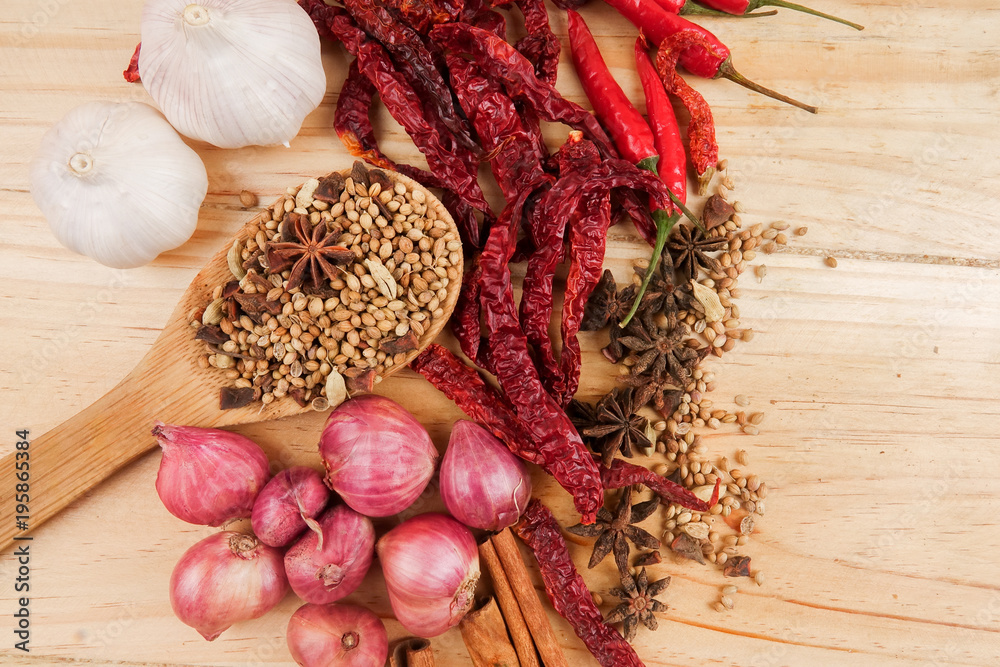 Mixture of beautiful spices and herbs on a wooden table Mixture of beautiful spices and herbs on a wooden table
