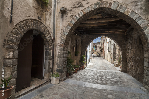 Ancient street view,carrer avall, of medieval village of Angles,province Girona,Catalonia.Spain.