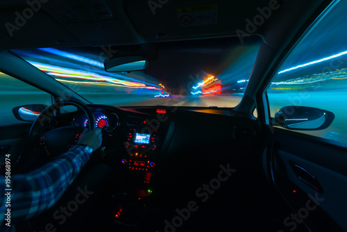 Driving in night scenery, hands on steering wheel, night rain time
