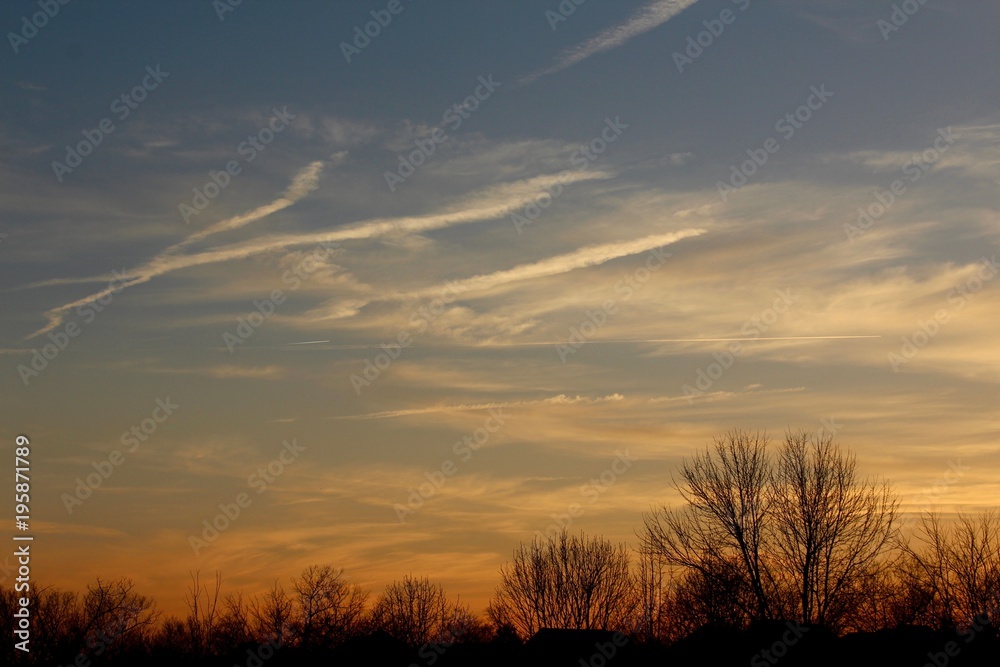 The orange sky in the evening during sunset. 