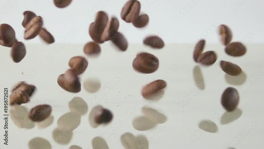 Slow motion of roasted coffee beans falling on table 2 in 1 500fps Slow motion of roasted coffee beans falling on table 2 in 1 500fps