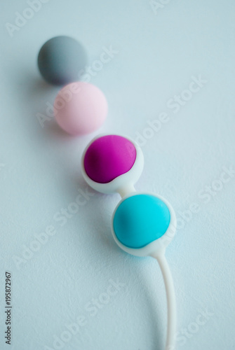 Color Kegel balls, Geisha balls in white background photo