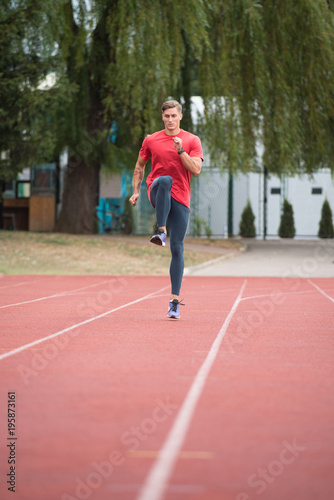 Portrait of Sporty Man on Running Track