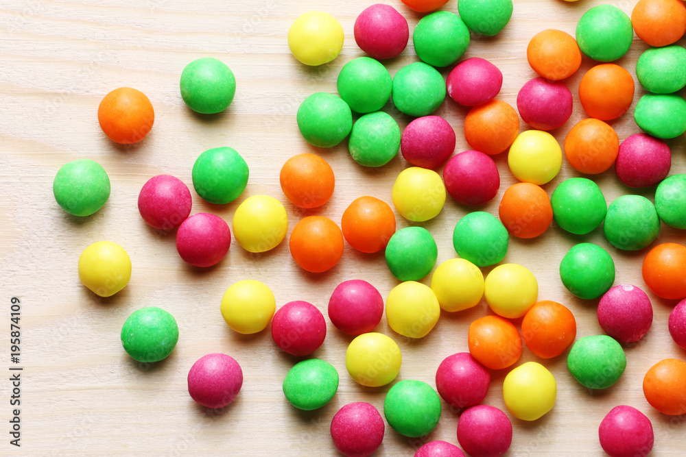 Colorful sweet candies on a wood background Colorful sweet candies on a wood background