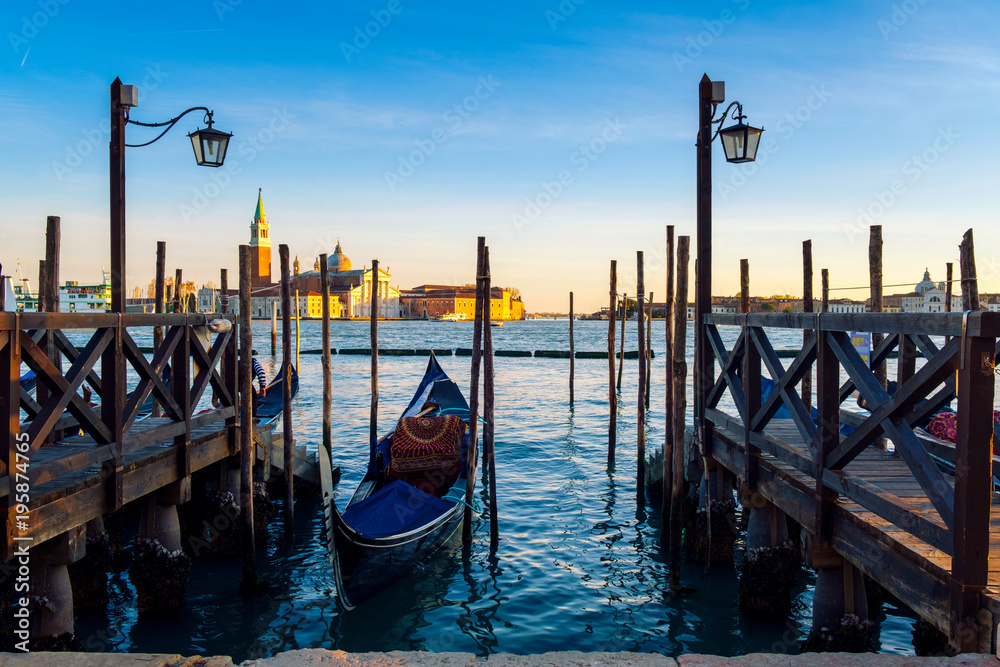 Venice with famous gondolas  in lagoon at sunrise