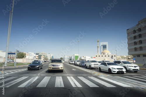 City life - road with a pedestrian crossing, cars.