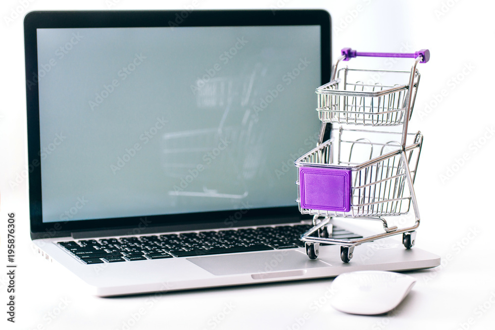 Shopping cart and computer on White background, Shopping intent, online shopping