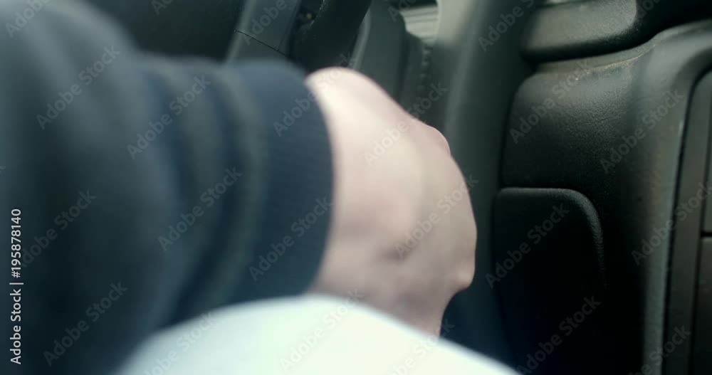 The man's hand turns the ignition key old car The man's hand turns the ignition key old car