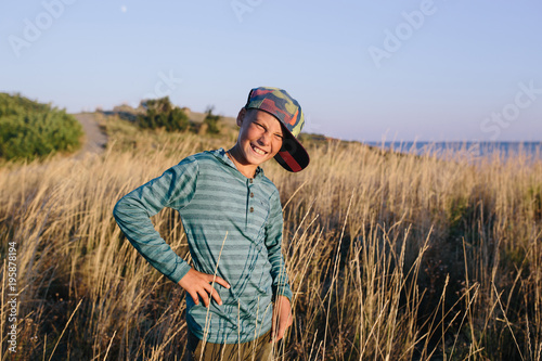 Portrait of a smiling boy in the field © skvalval