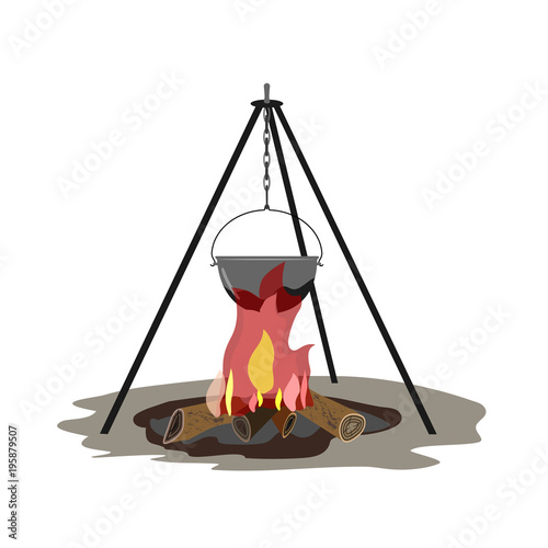 The teapot hangs on the tripod. Below is a fire burning.