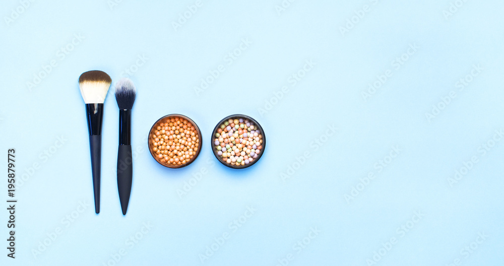 Set of decorative cosmetics for make-up Powder Rouge Corrector Brushes on blue background. Makeup Accessories Top view Flat Lay