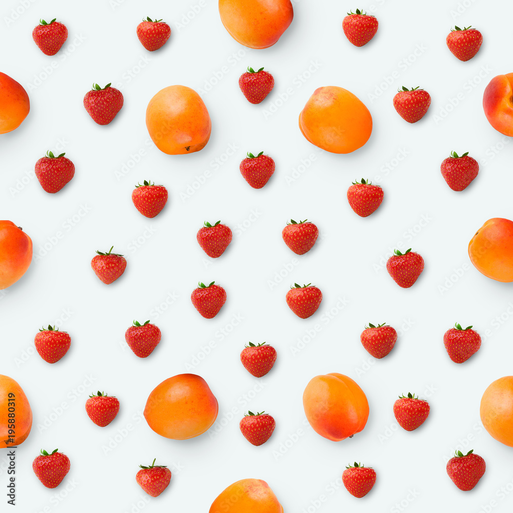 Pattern made of apricots and strawberries, top view Pattern made of apricots and strawberries, top view