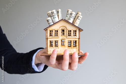 Real estate concept. Real estate and mortgage investment. Being an easy way homeowner. real estate risk. The man hold the house. 