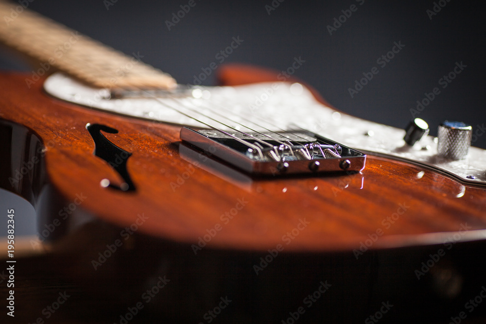 Fototapeta premium Close up of vintage electric guitar. Musical instrument for jazz , rock and blues styles. Black background