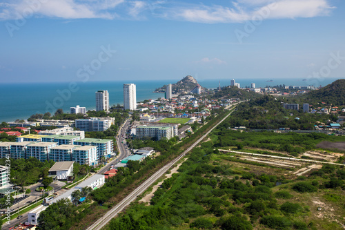 Cityscape and sea view from high position with blue sky in sunshine day
