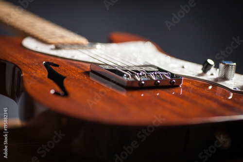 Close up of vintage electric guitar. Musical instrument for jazz , rock and blues styles. Black background
